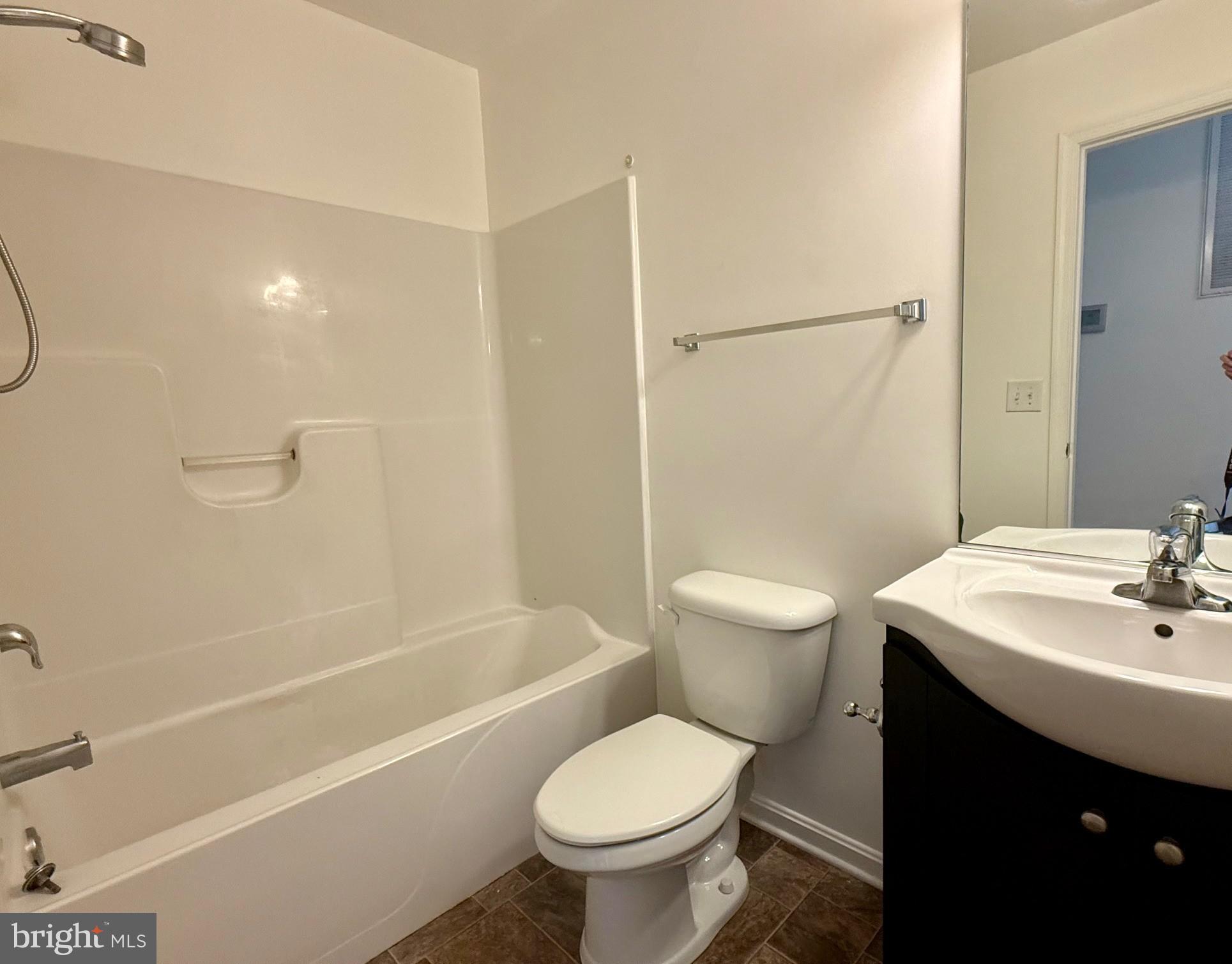 18871 Three Notch Road Lexington Park, MD 20653 - Photo 21 of 34 a bathroom with a sink toilet and shower