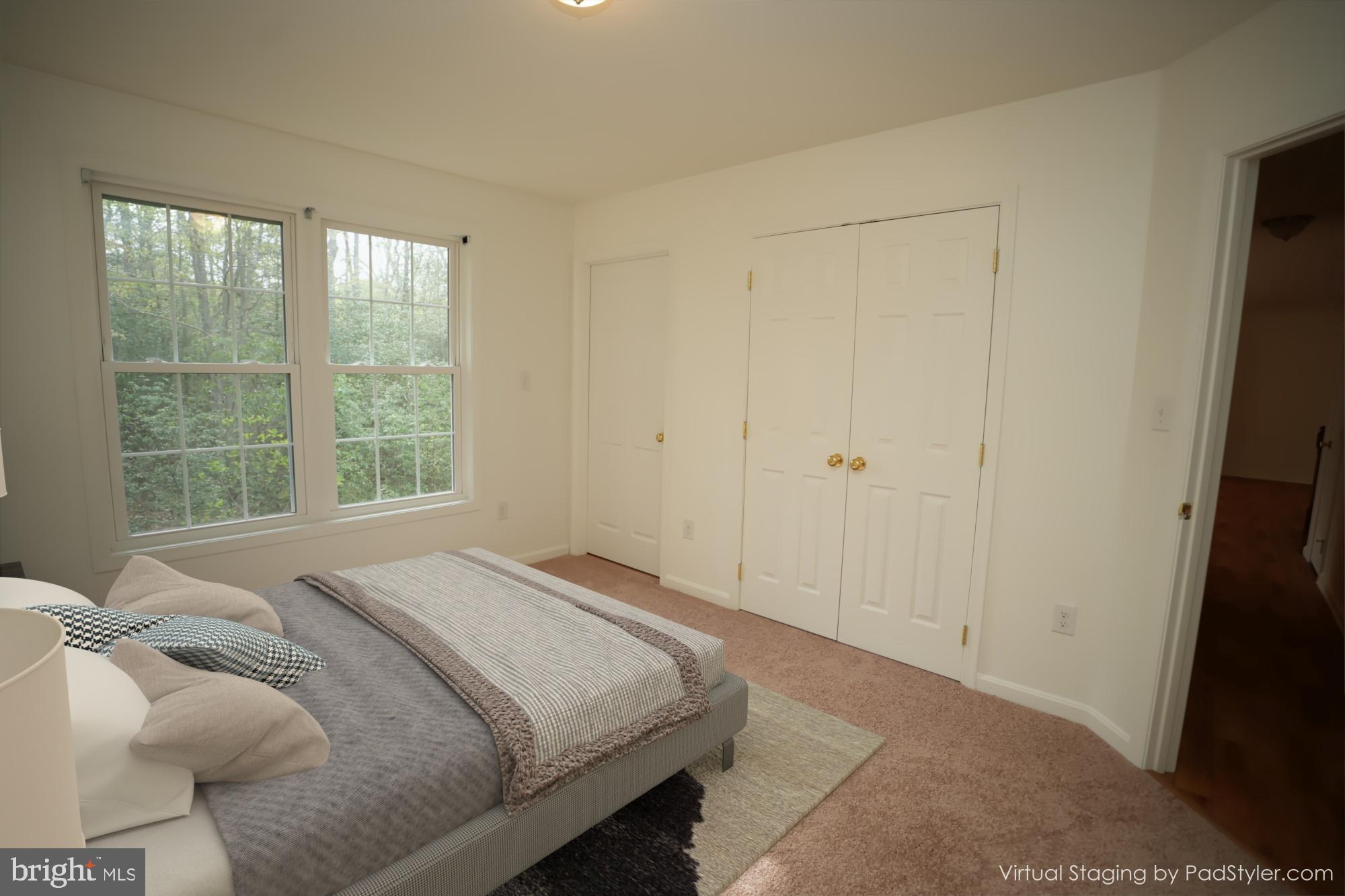 18871 Three Notch Road Lexington Park, MD 20653 - Photo 5 of 34 a bedroom with a bed and a window