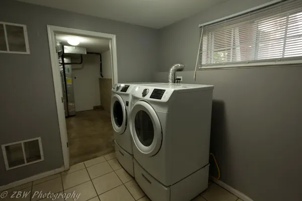 a utility room with dryer and washer