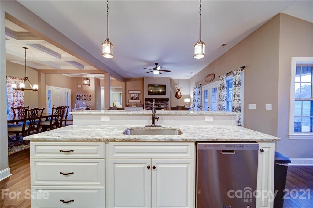 5801 Sikes Mill Road Monroe, NC 28110 - Photo 11 of 41 a bathroom with a granite countertop sink a large mirror and vanity