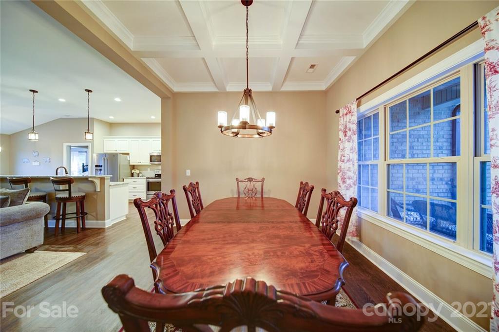 5801 Sikes Mill Road Monroe, NC 28110 - Photo 19 of 41 a dining room with furniture a chandelier and window