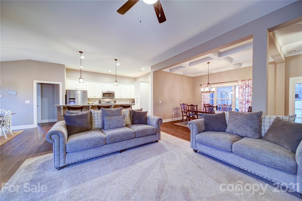 5801 Sikes Mill Road Monroe, NC 28110 - Photo 22 of 41 a living room with furniture kitchen view and a large window