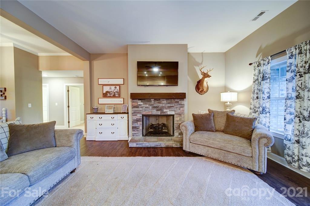 5801 Sikes Mill Road Monroe, NC 28110 - Photo 24 of 41 a living room with furniture and a fireplace