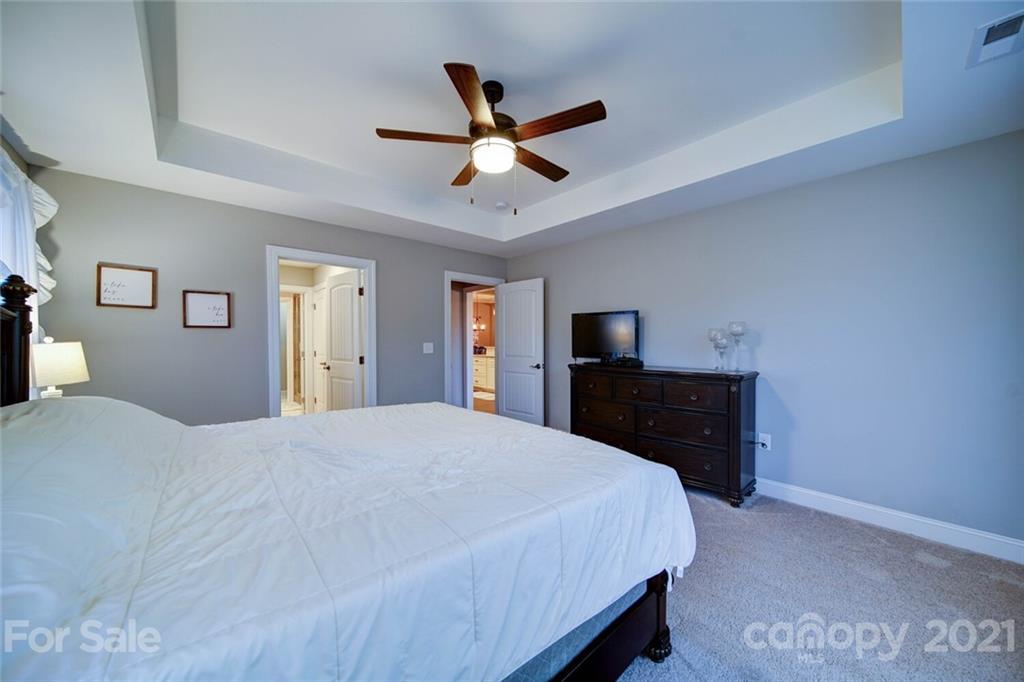 5801 Sikes Mill Road Monroe, NC 28110 - Photo 27 of 41 a bedroom with a bed and a tv