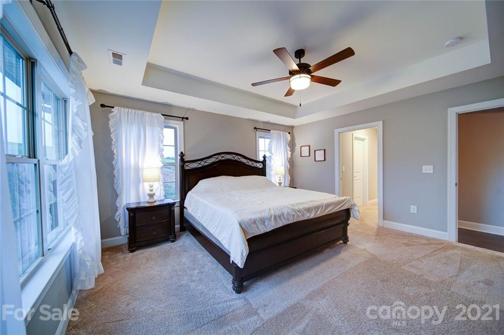 5801 Sikes Mill Road Monroe, NC 28110 - Photo 28 of 41 a bedroom with a bed and window