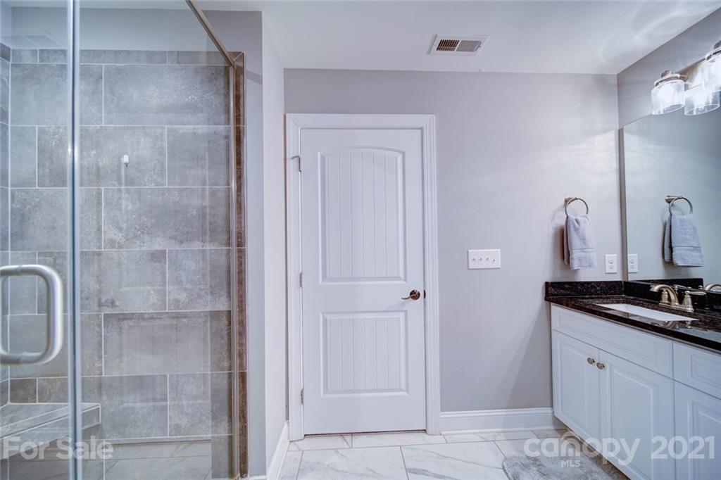 5801 Sikes Mill Road Monroe, NC 28110 - Photo 31 of 41 a bathroom with a shower