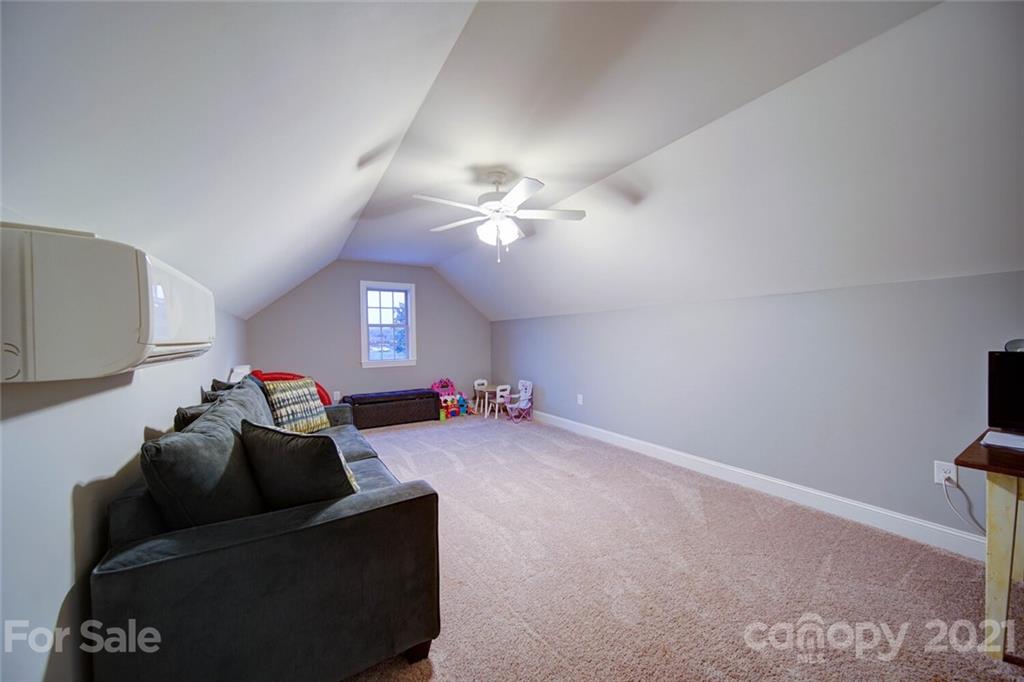 5801 Sikes Mill Road Monroe, NC 28110 - Photo 33 of 41 a living room with furniture and a ceiling fan