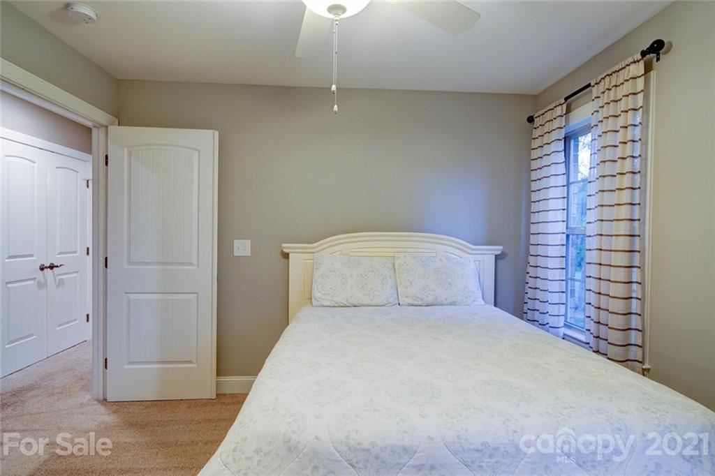 5801 Sikes Mill Road Monroe, NC 28110 - Photo 37 of 41 a bedroom with a bed and a shower