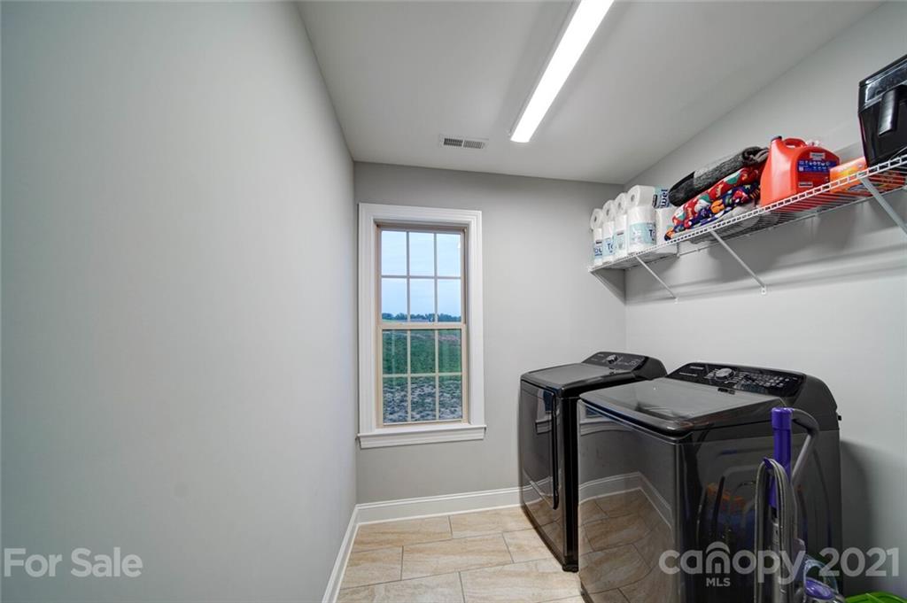5801 Sikes Mill Road Monroe, NC 28110 - Photo 40 of 41 a utility room with dryer and washer