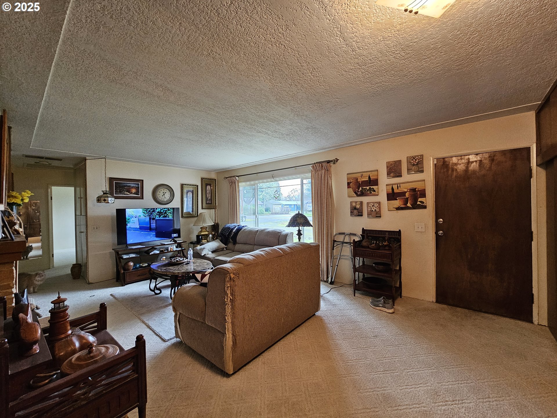 2462 Austin Road Roseburg, OR 97471 - Photo 14 of 36 a living room with furniture a window and a flat screen tv