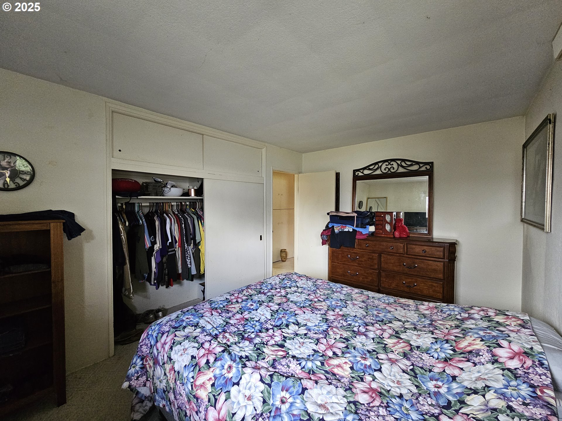 2462 Austin Road Roseburg, OR 97471 - Photo 16 of 36 a bed room with a bed and a mirror