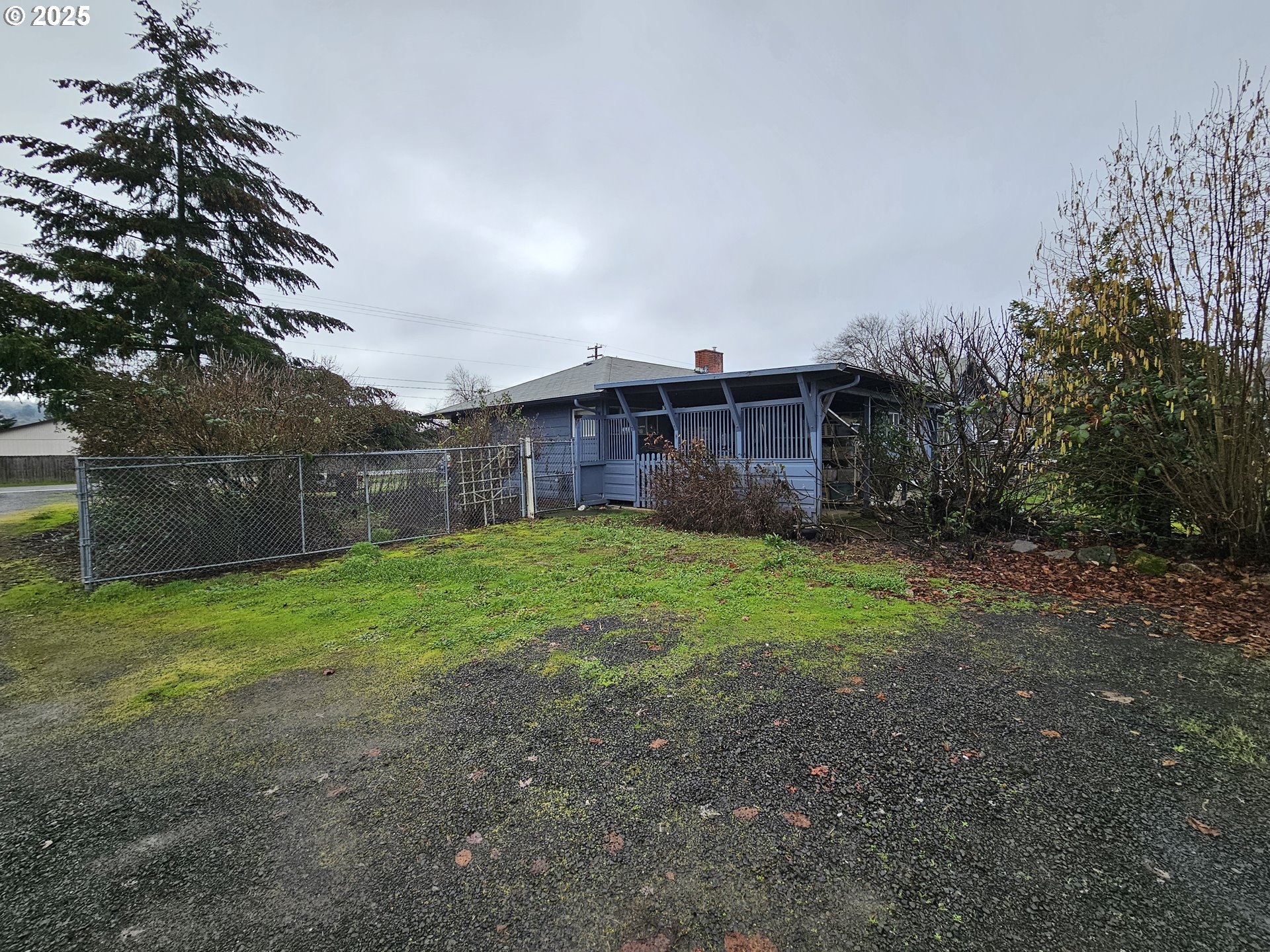 2462 Austin Road Roseburg, OR 97471 - Photo 35 of 36 a view of a house with backyard and a garden