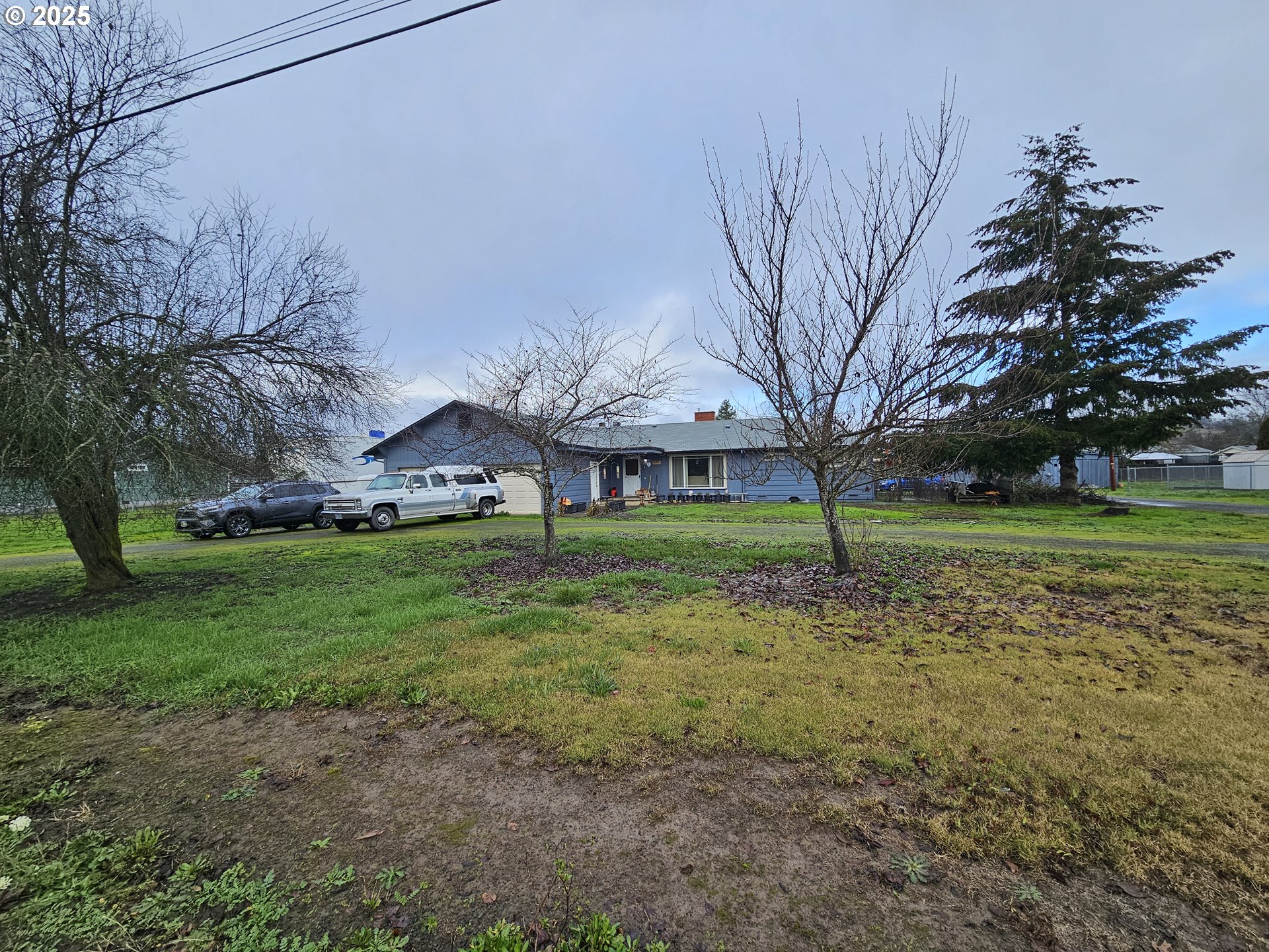 2462 Austin Road Roseburg, OR 97471 - Photo 4 of 36 a view of a house with a yard