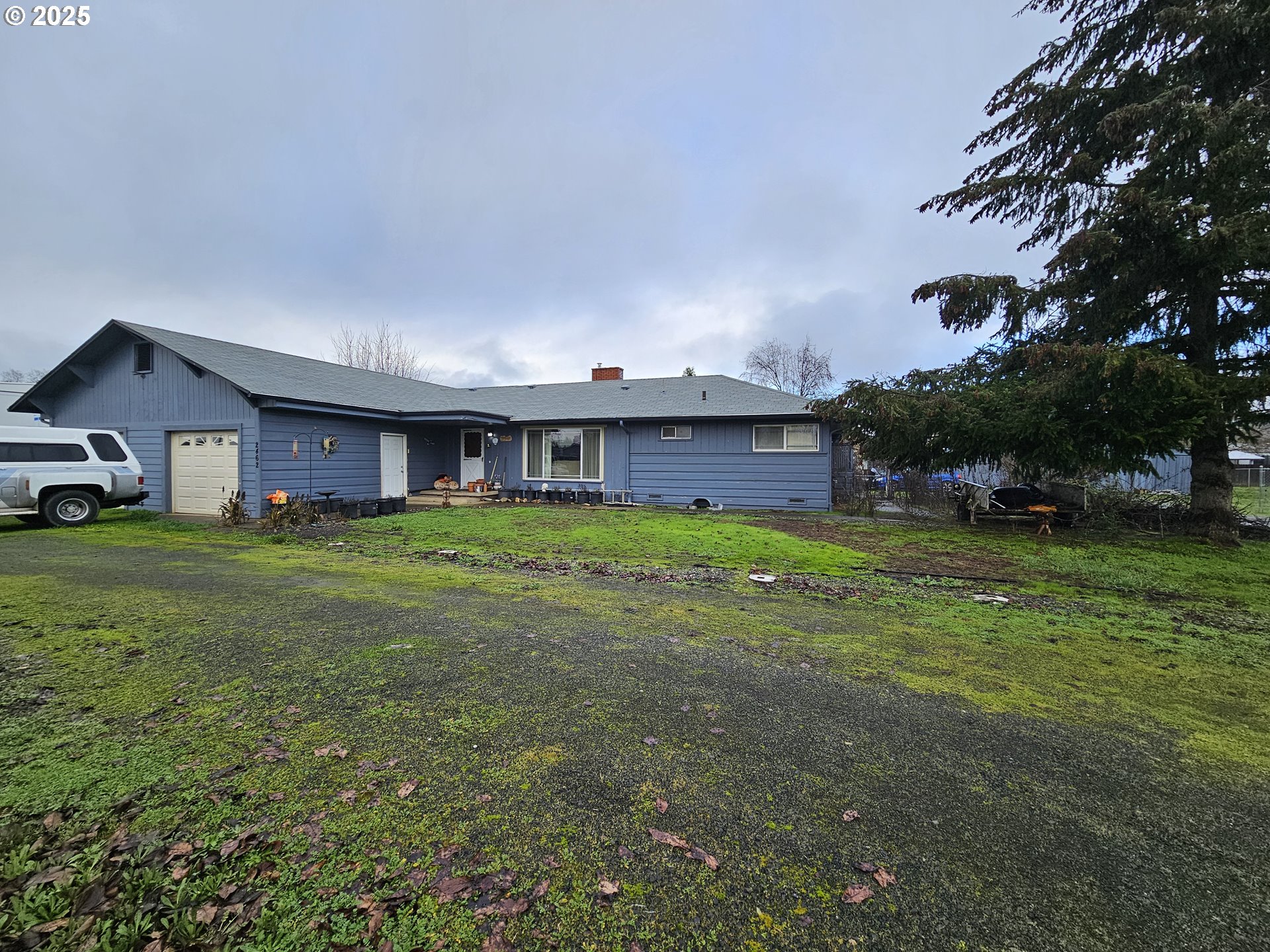 2462 Austin Road Roseburg, OR 97471 - Photo 7 of 36 a view of an house with backyard space and balcony