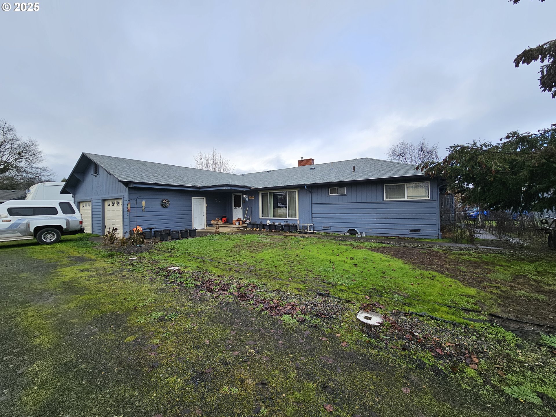 2462 Austin Road Roseburg, OR 97471 - Photo 8 of 36 a view of a house with a back yard
