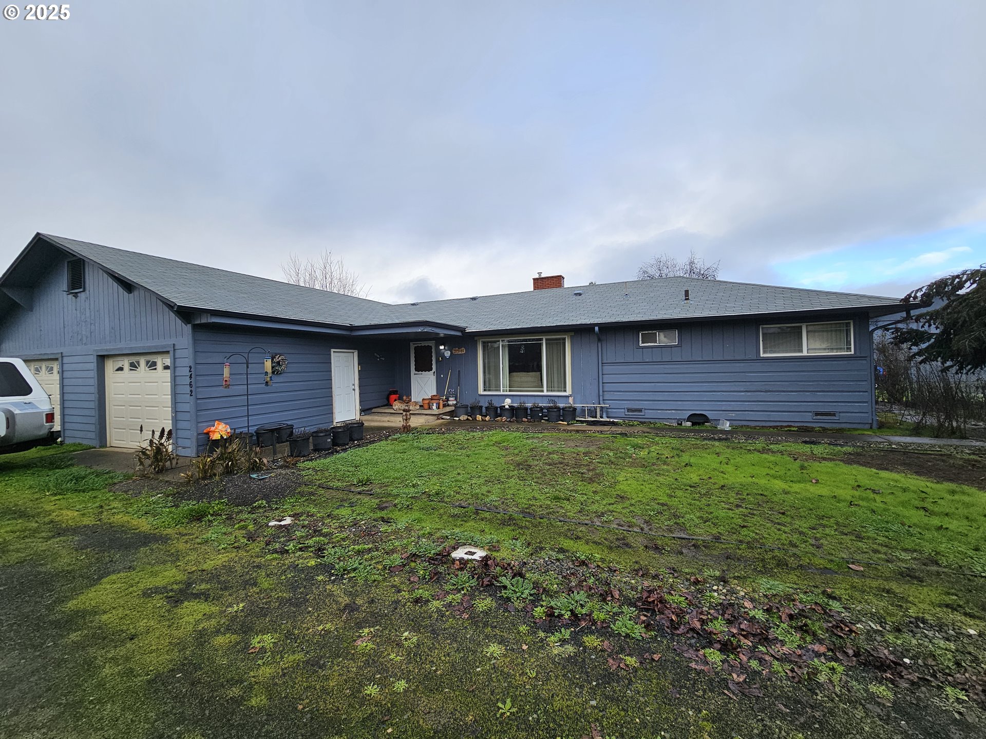 2462 Austin Road Roseburg, OR 97471 - Photo 9 of 36 a view of a house with a back yard