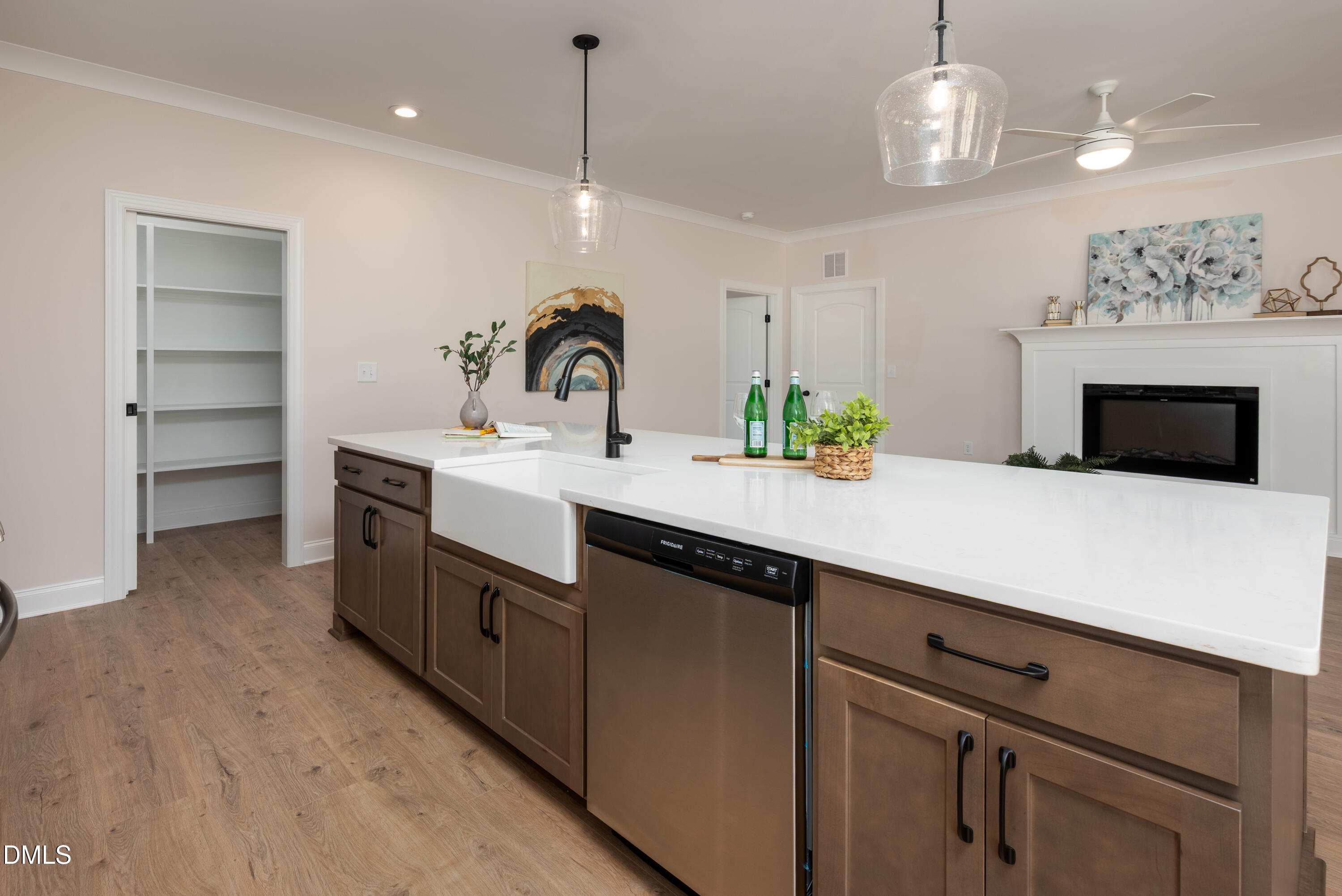 2275 Peachtree Hills Road Spring Hope, NC 27882 - Photo 17 of 43 a kitchen with kitchen island a sink stainless steel appliances and a chandelier