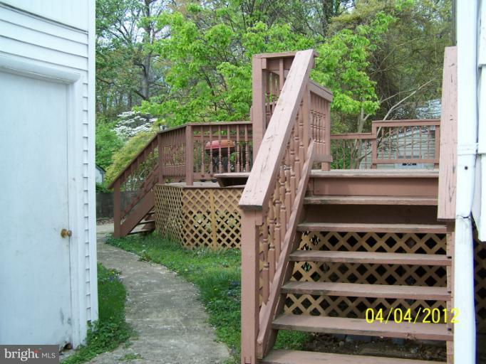 8704 Geren Road Silver Spring, MD 20901 - Photo 2 of 15 a view of a deck with wooden floor and fence