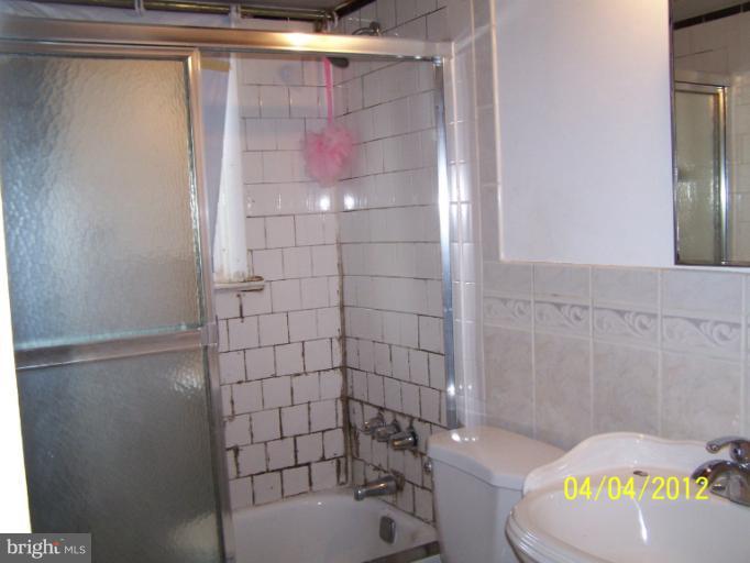 8704 Geren Road Silver Spring, MD 20901 - Photo 14 of 15 a bathroom with a bathtub and shower