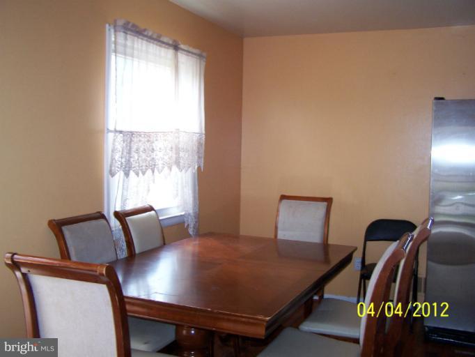 8704 Geren Road Silver Spring, MD 20901 - Photo 6 of 15 a view of a workspace with furniture and a window