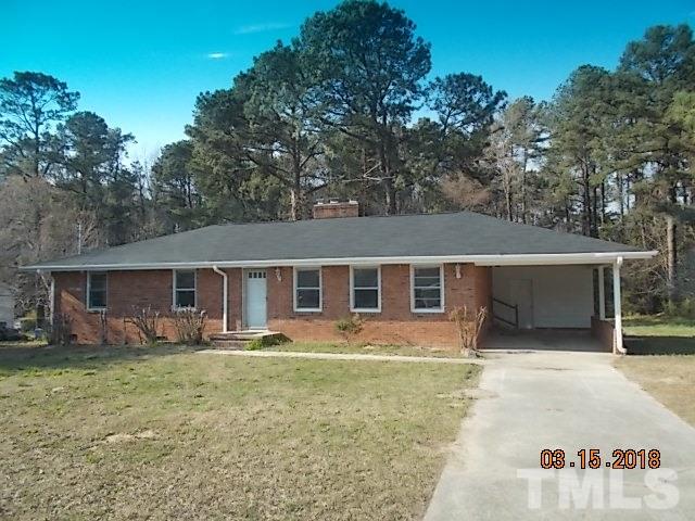 3933 Buffaloe Road Raleigh, NC 27604 - Photo 1 of 16 front view of house with a yard