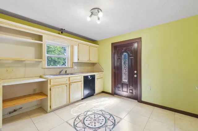 a large bathroom with a bathtub and a sink