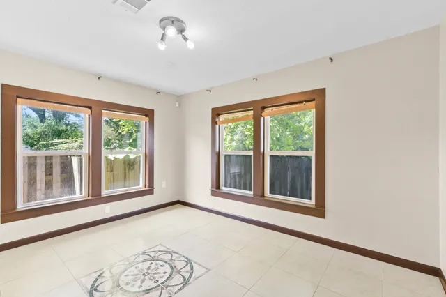a view of an empty room with a window