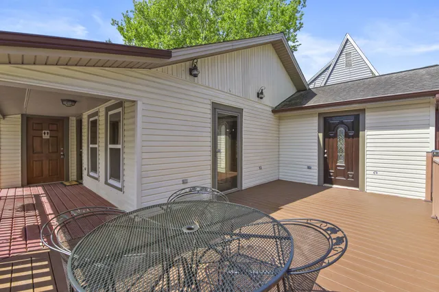 a view of a house with backyard and porch