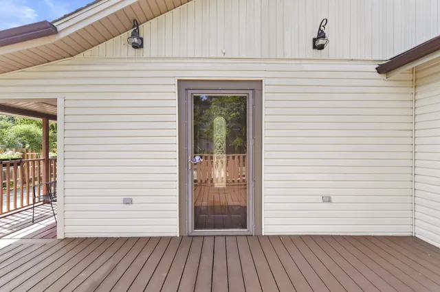 a view of a balcony with wooden floor