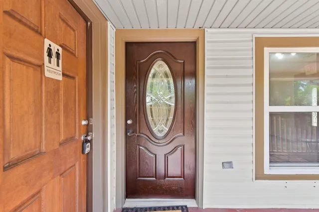 a front view of a house with garden