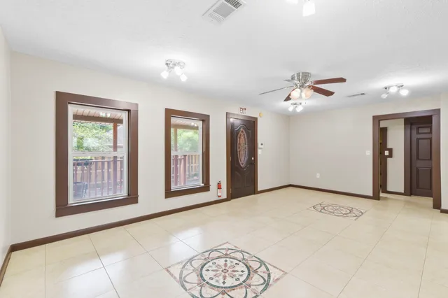 a view of an empty room with a window