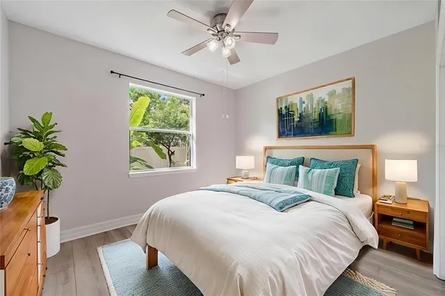 a bedroom with a large bed and a window