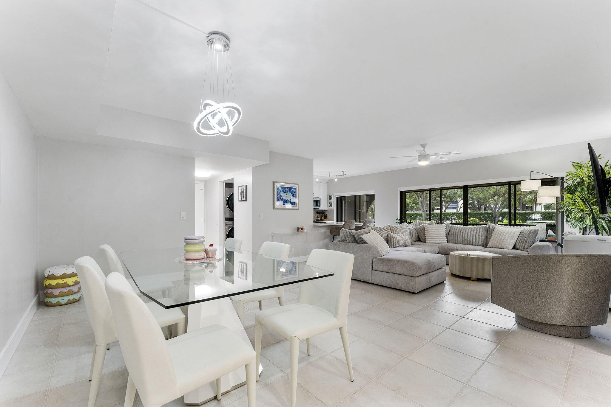 6314 Longboat Lane West, Unit 102 Boca Raton, FL 33433 - Photo 1 of 24 a view of a dining room with furniture window and outside view