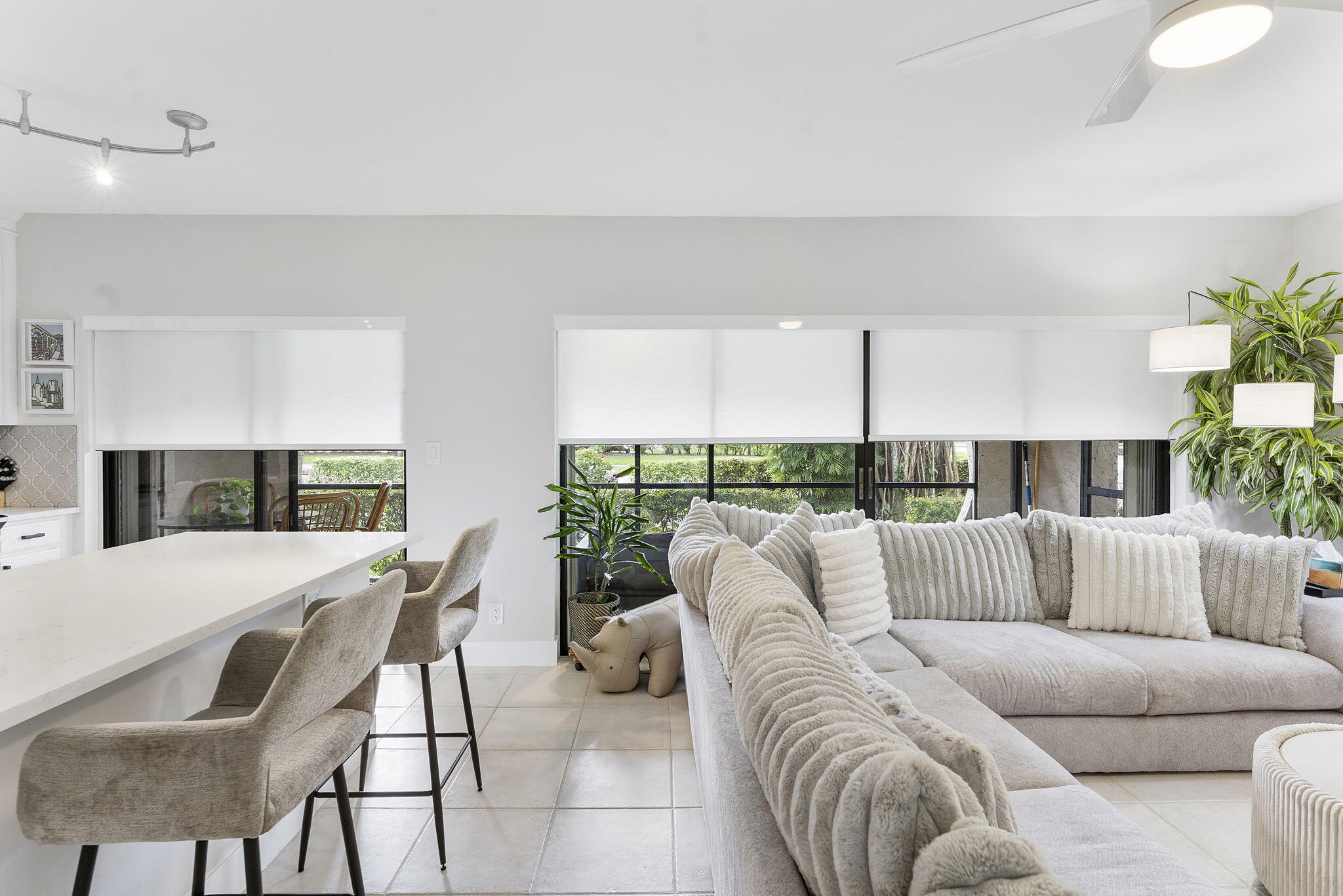 6314 Longboat Lane West, Unit 102 Boca Raton, FL 33433 - Photo 14 of 24 a living room with furniture and a large window