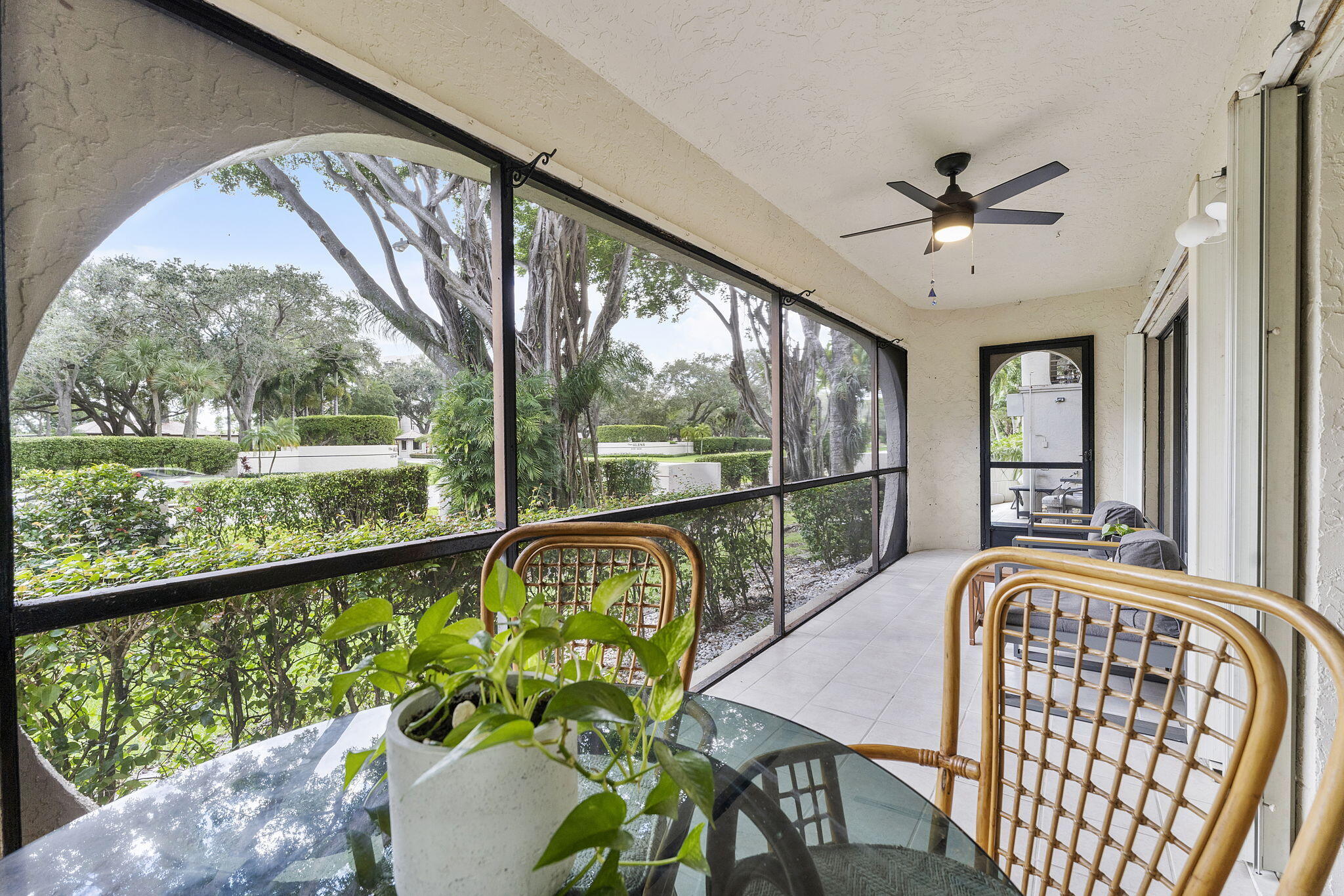6314 Longboat Lane West, Unit 102 Boca Raton, FL 33433 - Photo 23 of 24 a view of a porch with furniture and a window