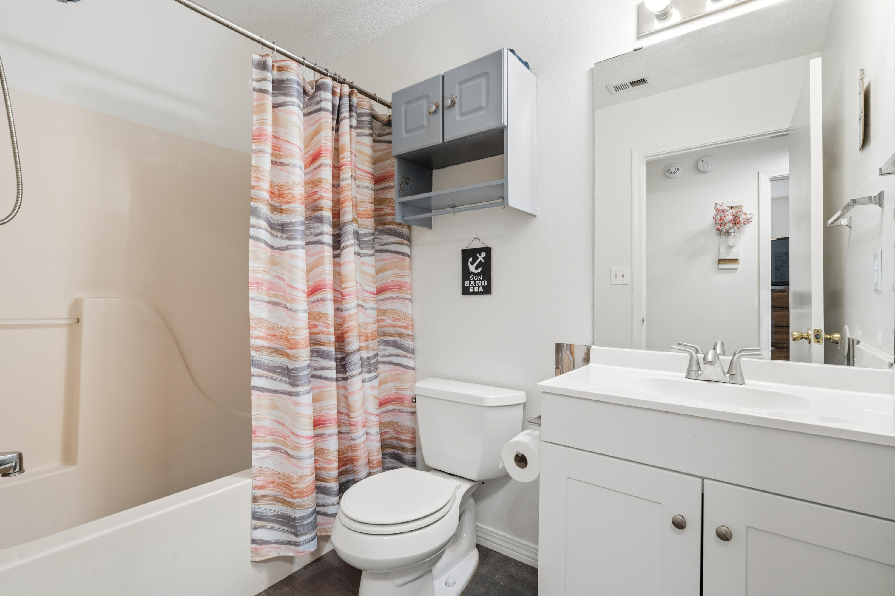 2880 Aplin Road Crestview, FL 32539 - Photo 24 of 33 a bathroom with a sink toilet vanity and shower