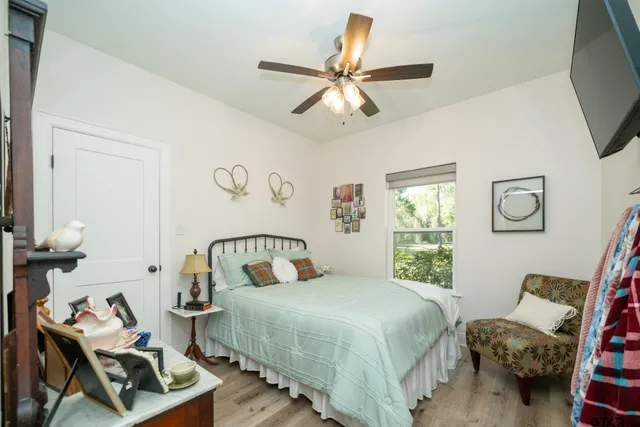 a large kitchen with a table and chairs in it