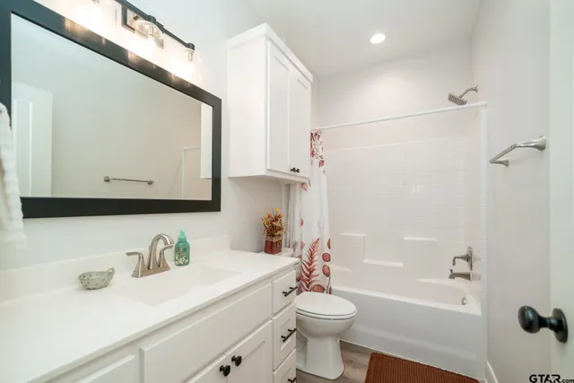 a bedroom with a bed and a cabinets