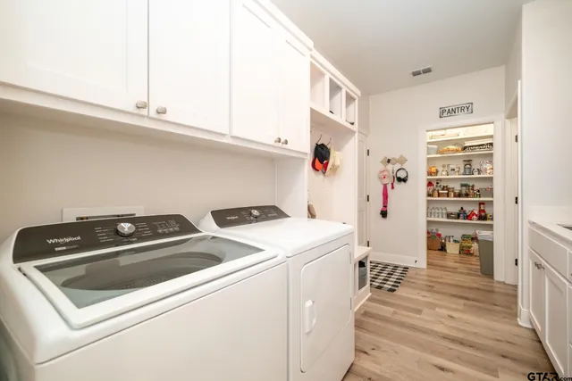 a bathroom with a granite countertop toilet and a shower