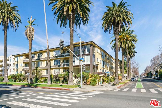 a front view of residential houses with a street