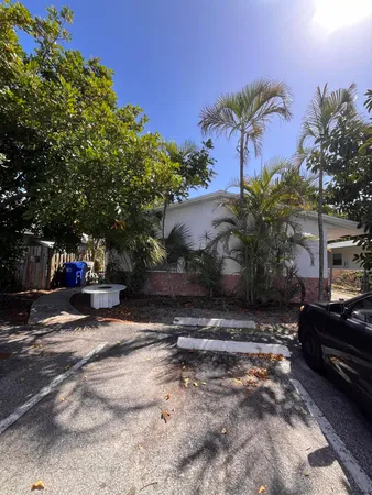 a view of street with wooden fence