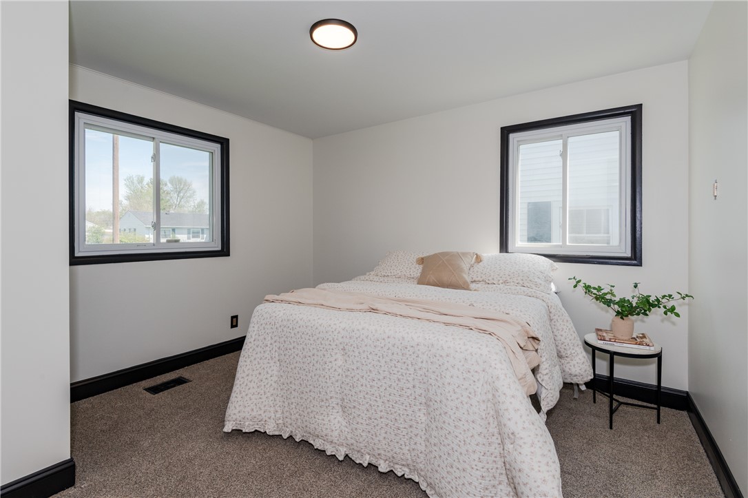 5240 Haverfield Road Dayton, OH 45432 - Photo 37 of 58 This cozy bedroom features bright windows, providing a comfortable and inviting atmosphere.
