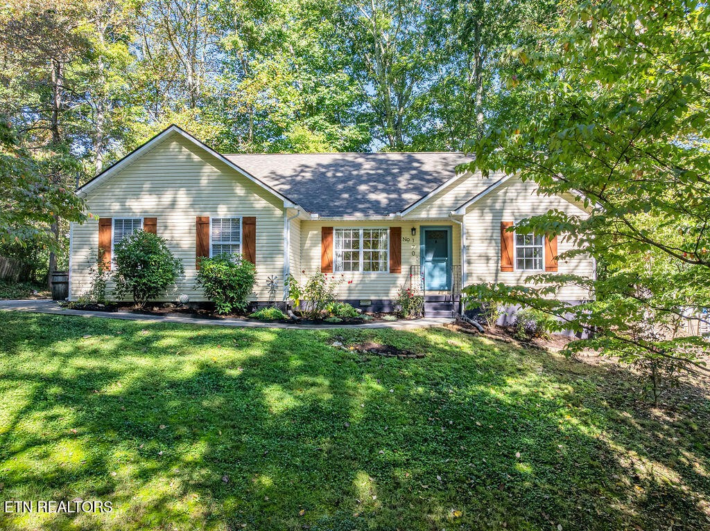 170 Cedar Circle Powell, TN 37849 - Photo 1 of 27 a front view of a house with yard and green space