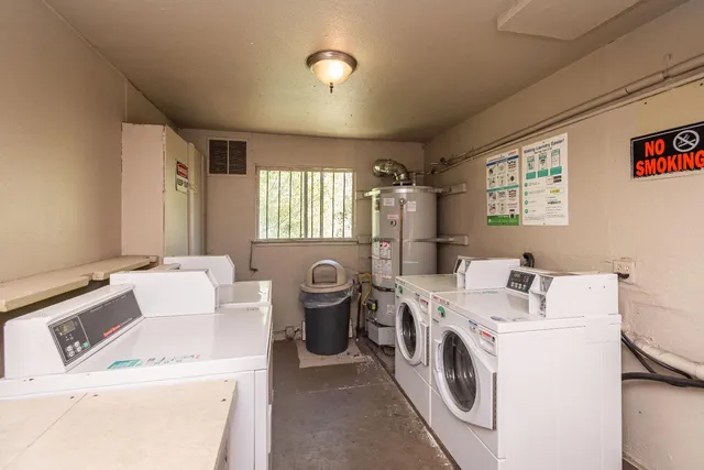 a view of empty room with wooden floor and window