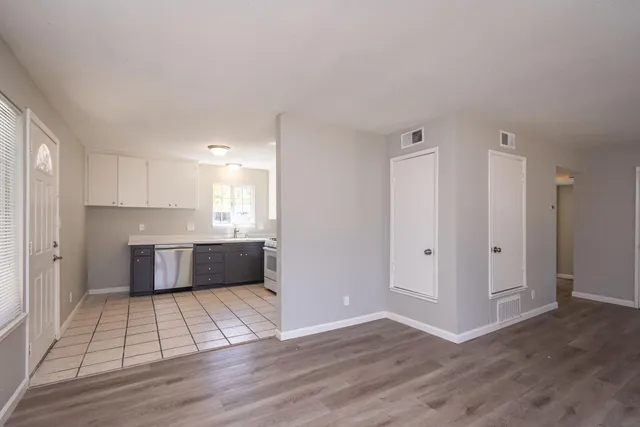 a kitchen with a sink a stove and refrigerator