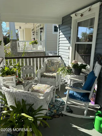a outdoor living space with patio furniture and potted plants