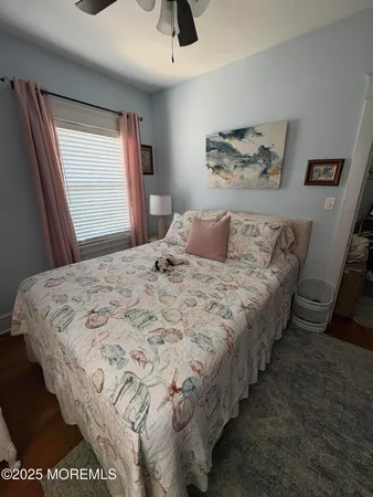 a bedroom with bed and window