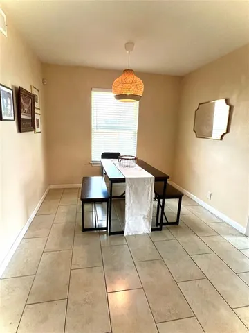 a room with a table and a mirror