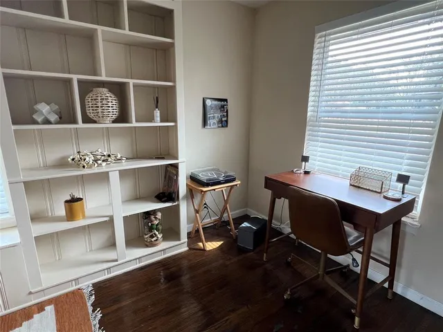 a workspace with furniture and a window
