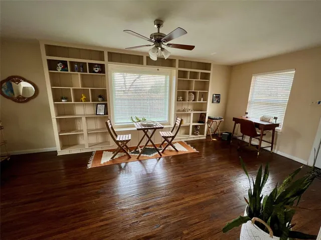 a view of a livingroom with furniture and a window
